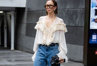 Woman in boho blouse and jeans