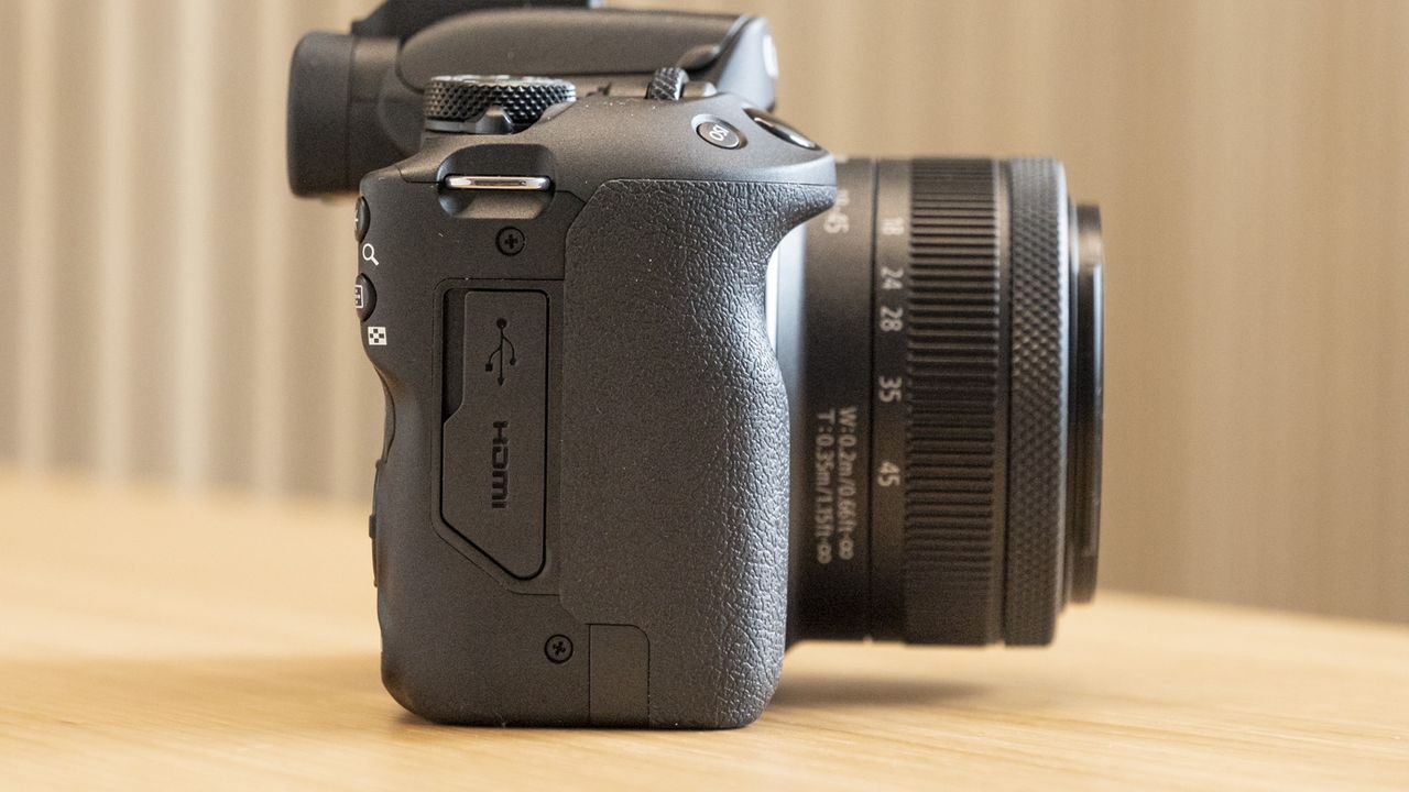 Side of Canon EOS R50 on a table with hdmi port