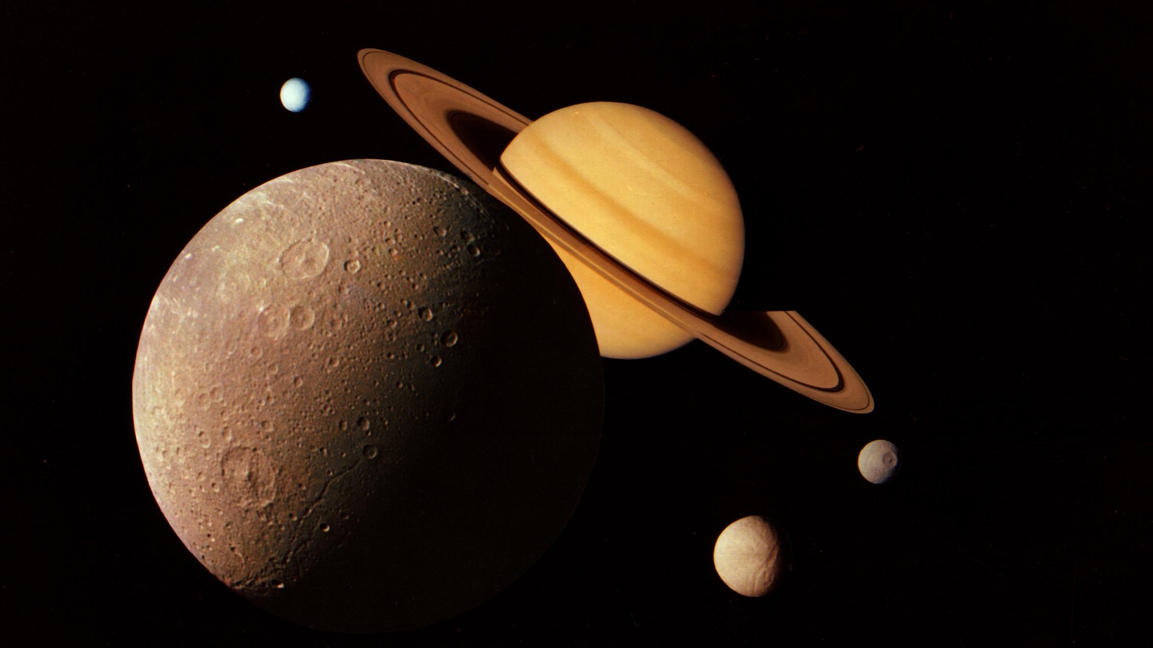 A view of Saturn surrounded by moons.