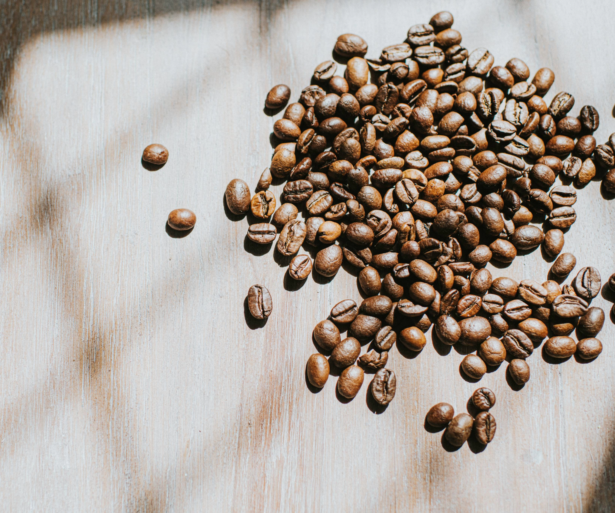 Coffee beans on a wooden surface