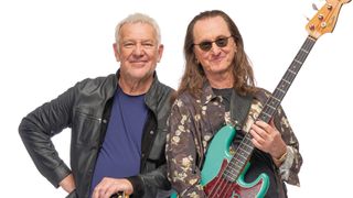 Rush's Alex Lifeson and Geddy Lee pose with their Gibson ES-355 and Fender Jazz Bass