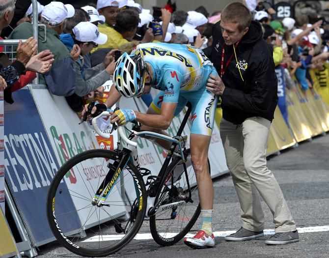 Westra needs help off his bike after a difficult stage