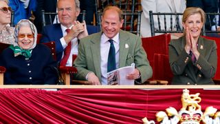 Queen Elizabeth, Prince Edward and Duchess Sophie sit side by side to watch the Royal Windsor Horse Show