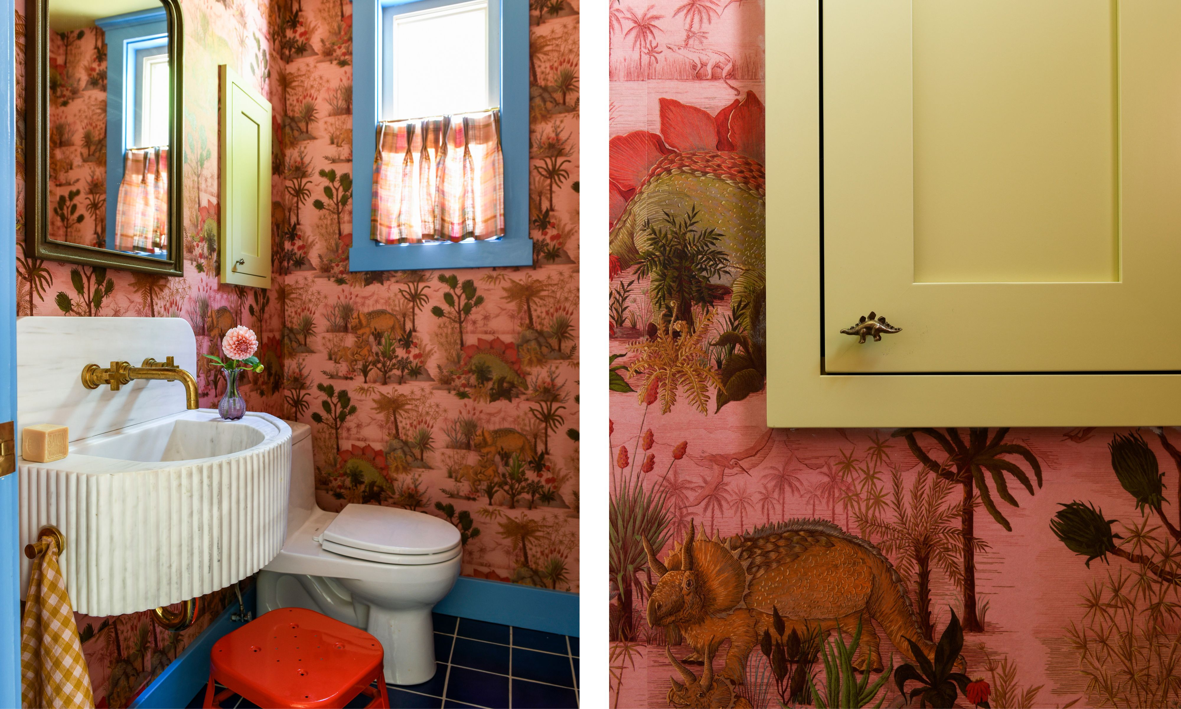 Two images of a powder room with pink dinosaur wallpaper, blue trim, and a green-yellow cabinet. Dark blue tiled flooring and a cafe curtain on the window.