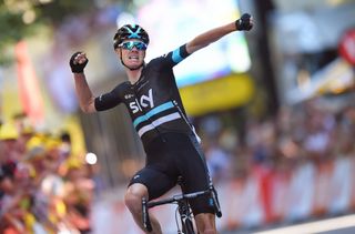 Chris Froome pumps the air after his daring attacks landed him the stage and yellow jersey