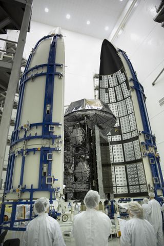The U.S. military's MUOS-3 tactical communications satellite is enshrouded in a nose cone fairing in preparation for its launch atop a United Launch Alliance Atlas V rocket on Jan. 20, 2015.