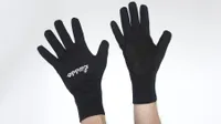 Lusso Windtex Thermo Stealth Gloves are shown in the image being worn by someone holding up their hands. They are considered a pair of the best winter cycling gloves. 