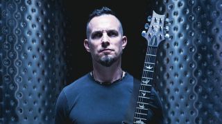 Mark Tremonti holding a guitar