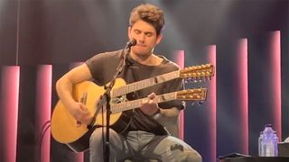 John Mayer playing a double-neck Martin guitar