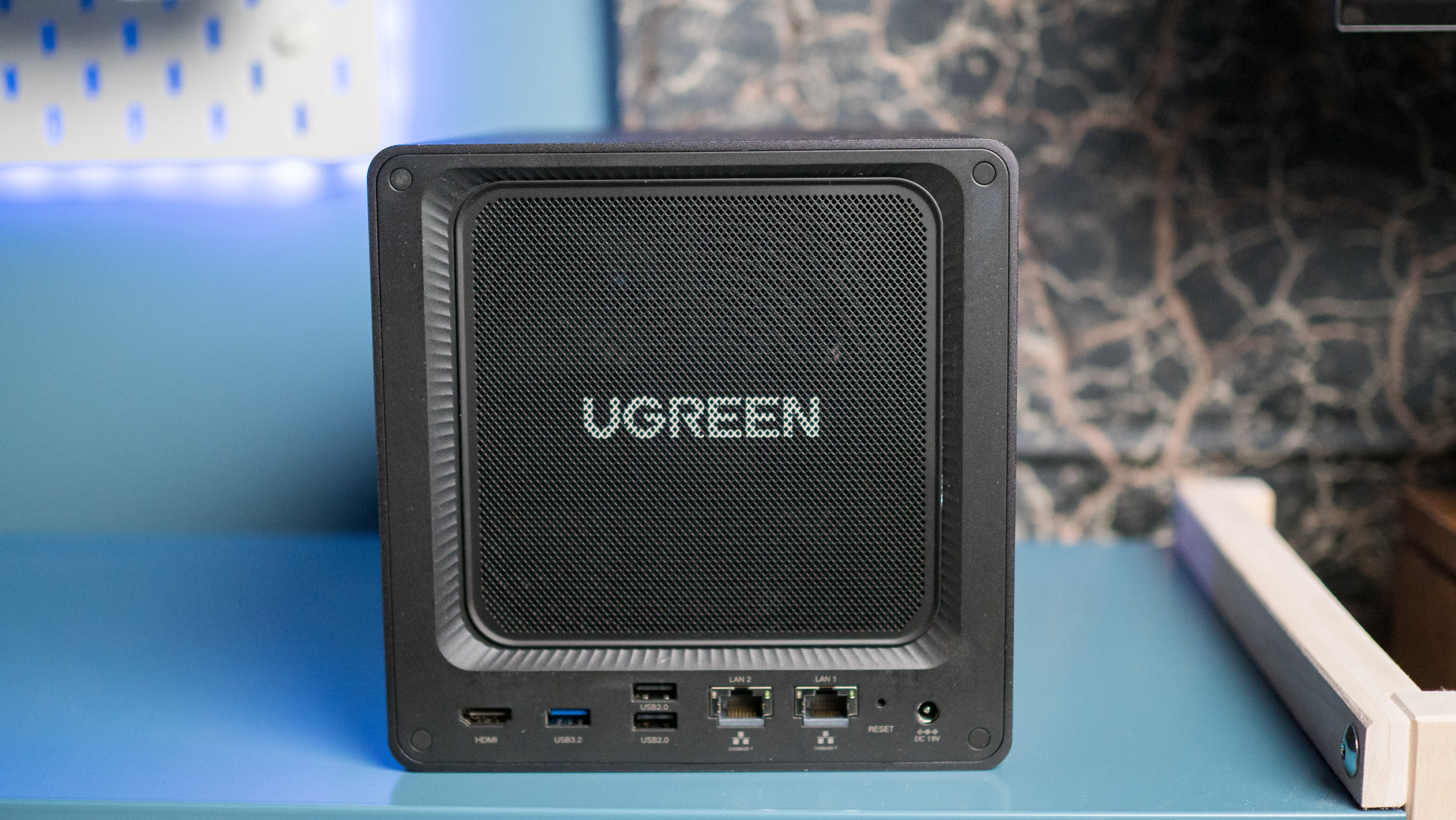 UGREEN DXP4800 Pro 4-bay NAS on a side table rear view