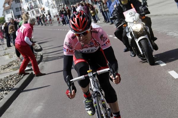 Cadel Evans tries to make it back to the front group after being split off in the crash of Team Sky.