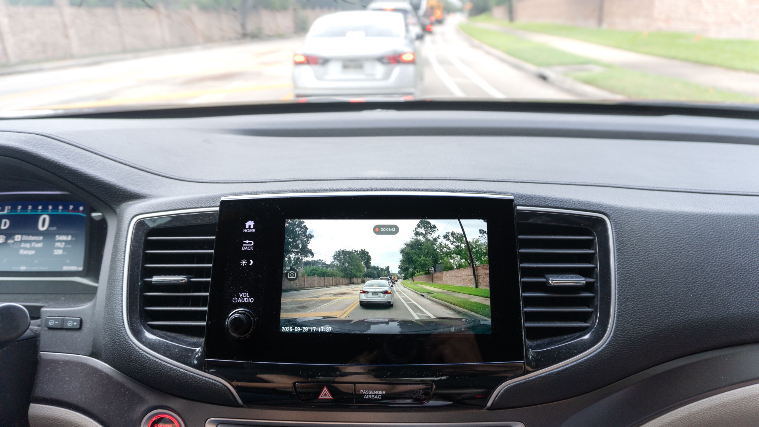 The live feed from the Ottocast OttoSafe Cam dash cam shown on a car's infotainment system