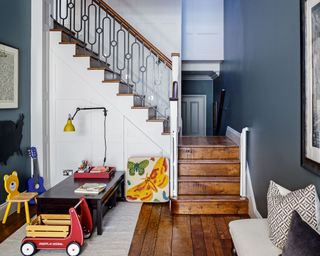 Dark blue playroom, dark brown stairs