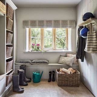 White walls with wooden basket and curtains on window