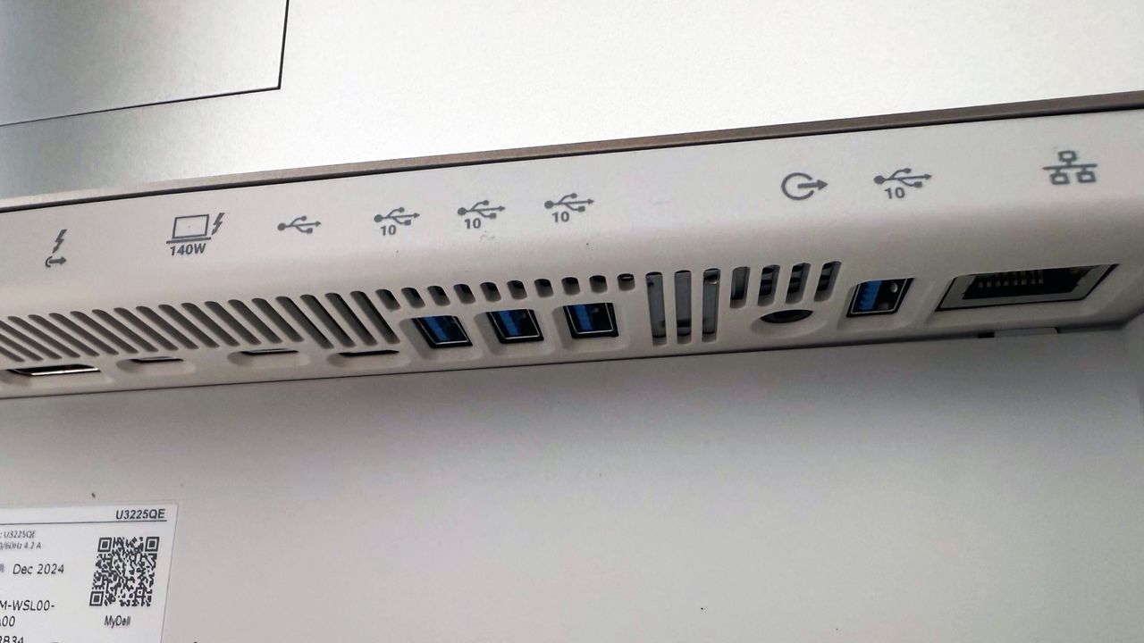 Dell UltraSharp 32 4K Thunderbolt Hub Monitor (U3225QE) on a white desk and gray background.