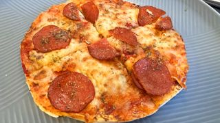 air fryer pizza cut into slices