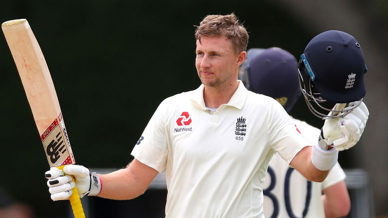 Joe Root celebrates scoring a century for England 