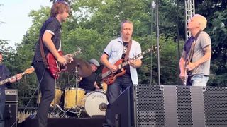Sadler Vaden, Jason Isbell and Mike McCready perming onstage in Seattle