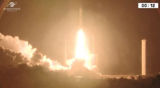 An Arianespace Ariane 5 rocket carrying the SES-14 communications satellite, with NASA's GOLD instrument, and the Al Yah 3 satellite lifts off from the Guiana Space Center in Kourou, French Guiana on Jan. 25, 2018.