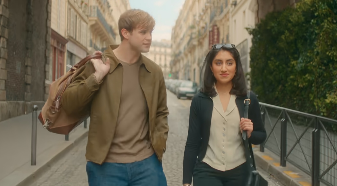 Dexter and Emma walk through the streets of Paris.