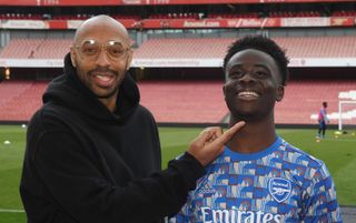 Arsenal legend Thierry Henry and forward Bukayo Saka