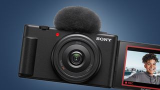 The Sony ZV-1F camera on a blue background