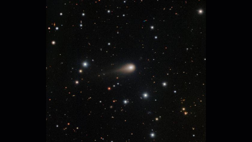 A streak of white shows interstellar comet 3I/ATLAS in the center of a starry night sky