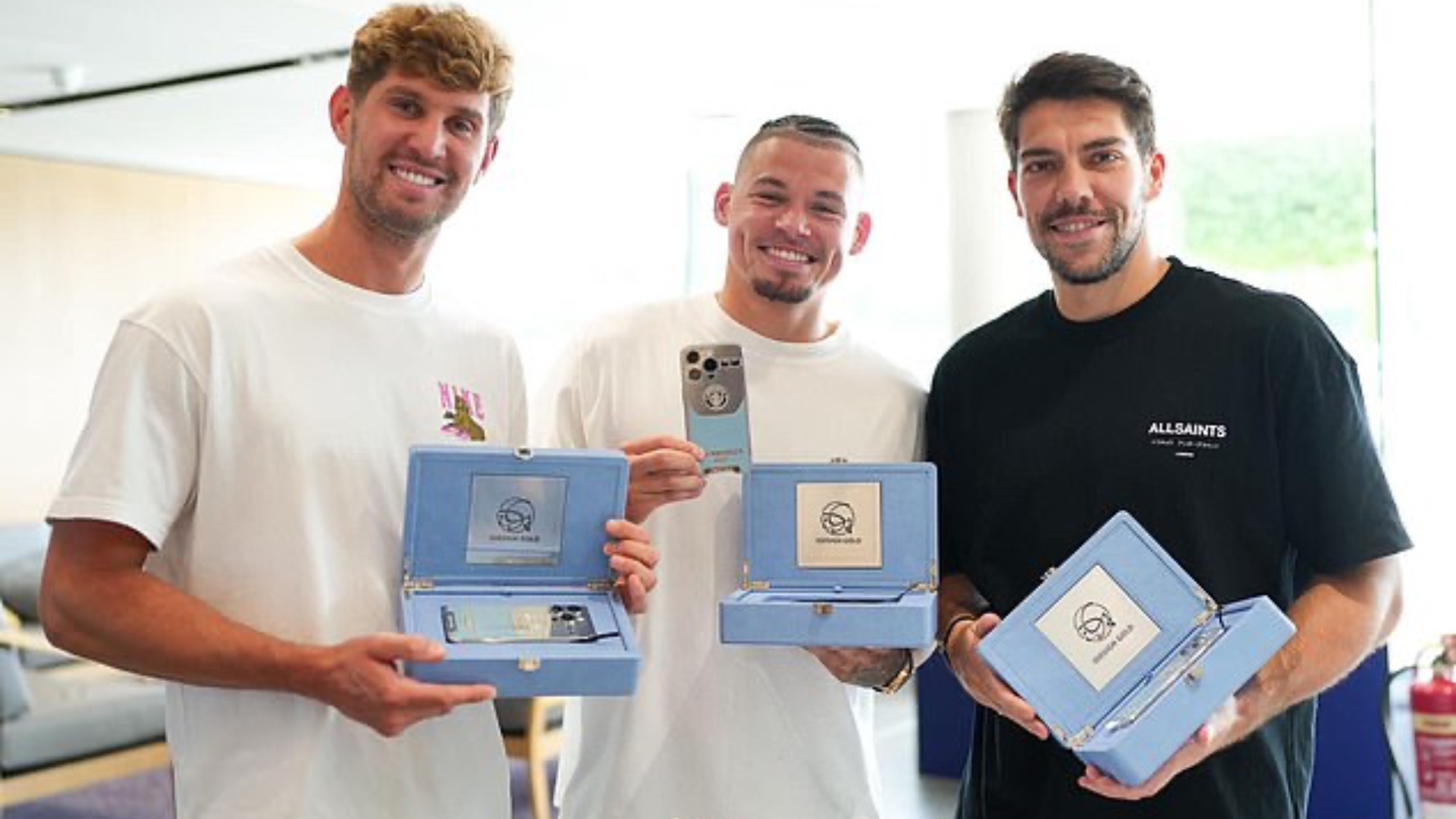 Manchester City players with custom iPhones
