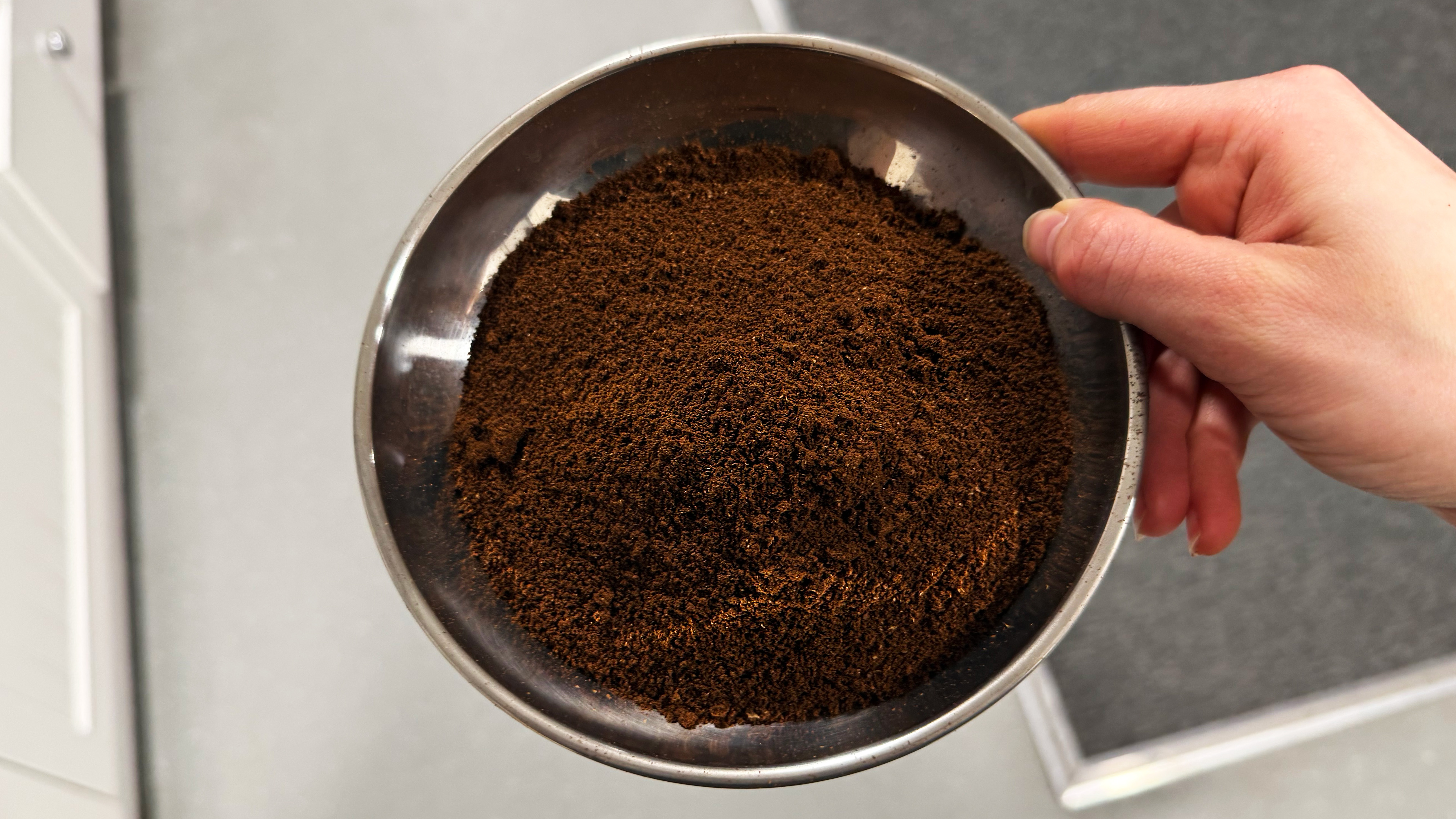 a photo of the timemore chestnut c2s grinder with coffee