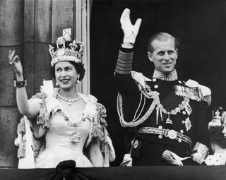Prince Philip young - Queen Elizabeth II and the Duke of Edinburgh wave at the crowds from the balcony at Buckingham Palace after Elizabeth's coronation, 2nd June 1953