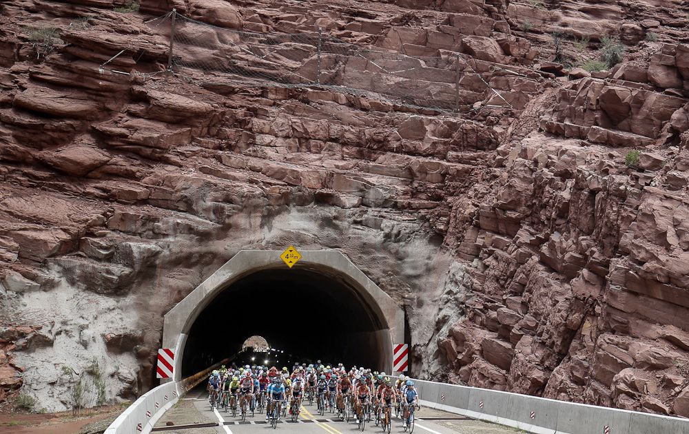 The peloton emerges from a tunnel during stage 4 in San Juan