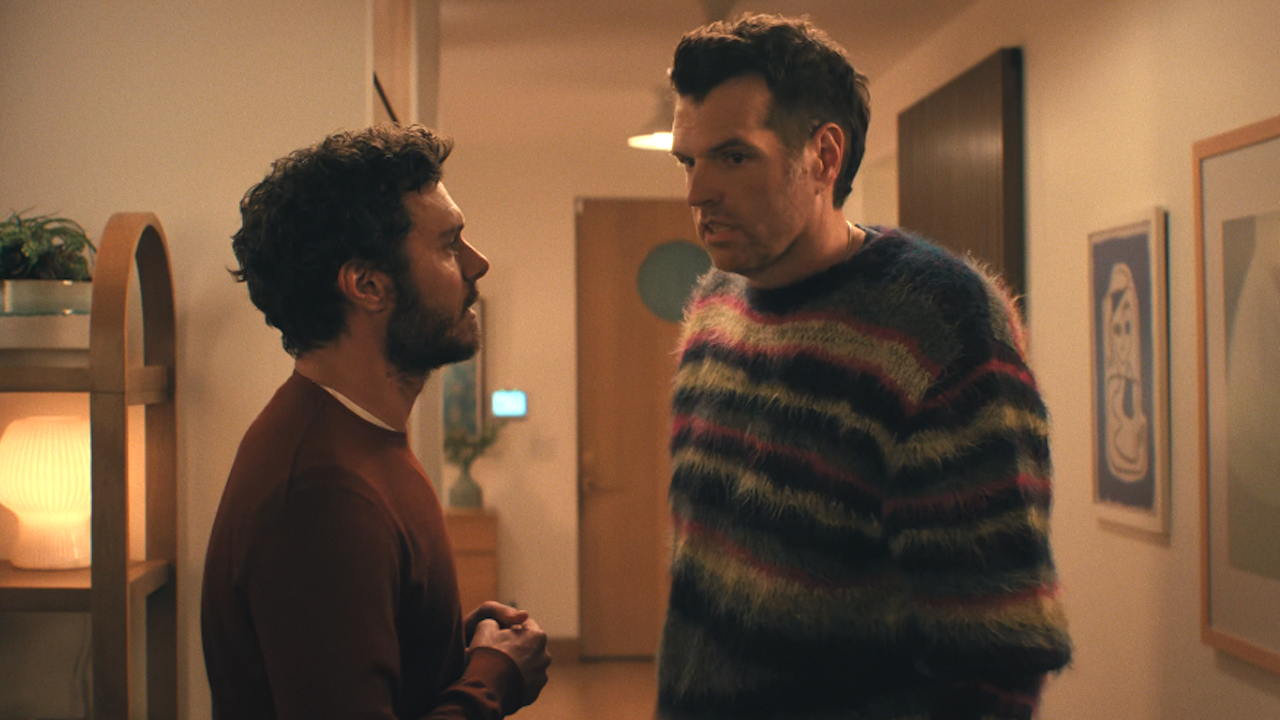 Adam Brody and Timothy Simons talking to each other in Nobody Wants This Season 2