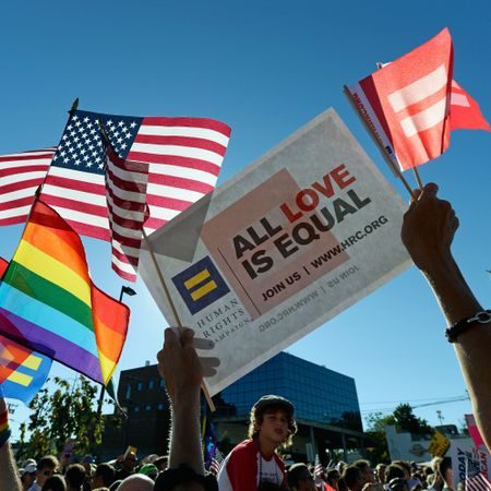 "All Love is Equal" - People gathered in support of Gay marriage holding USA  Rainbow-colored LGBTQ flags