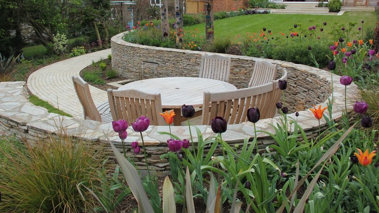 Sloping Garden Ideas 20 Landscaping And Styling Solutions For Plots On A Hill Gardeningetc - How To Lay A Patio On Sloping Garden