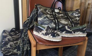A new take on camouflage blended both geometric and organic motifs covering totes, sheer scarves and espadrilles, which tied at the ankle