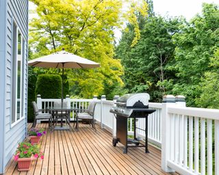 Home deck and patio with outdoor furniture and BBQ cooker