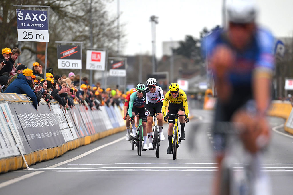 HARELBEKE, BELGIUM - MARCH 27: (L-R) Stan Dewulf of Belgium and Team Decathlon CMA CGM, Florian Vermeersch of Belgium and UAE Team Emirates - XRG and Per Strand Hagenes of Norway and Team Visma | Lease a Bike sprint at finish line during the 68th E3 Saxo Classic 2026 a 208.5km one day race from Harelbeke to Harelbek / #UCIWT / on March 27, 2026 in Harelbeke, Belgium. (Photo by Tim de Waele/Getty Images)