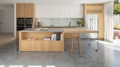 a kitchen with a polished concrete floor