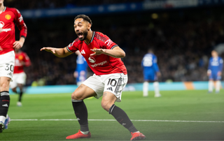 Matheus Cunha of Manchester United celebrates scoring their first goal during the Premier League match between Chelsea and Manchester United at Stamford Bridge on April 18, 2026 in London, England.