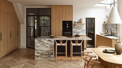 a wood and marble kitchen in an extension