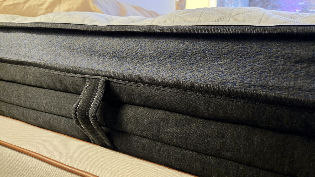 A closeup of the side handles of the upgraded Helix Midnight Luxe mattress