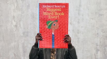 Richard Scarry Bottega Veneta Woven book being held by model