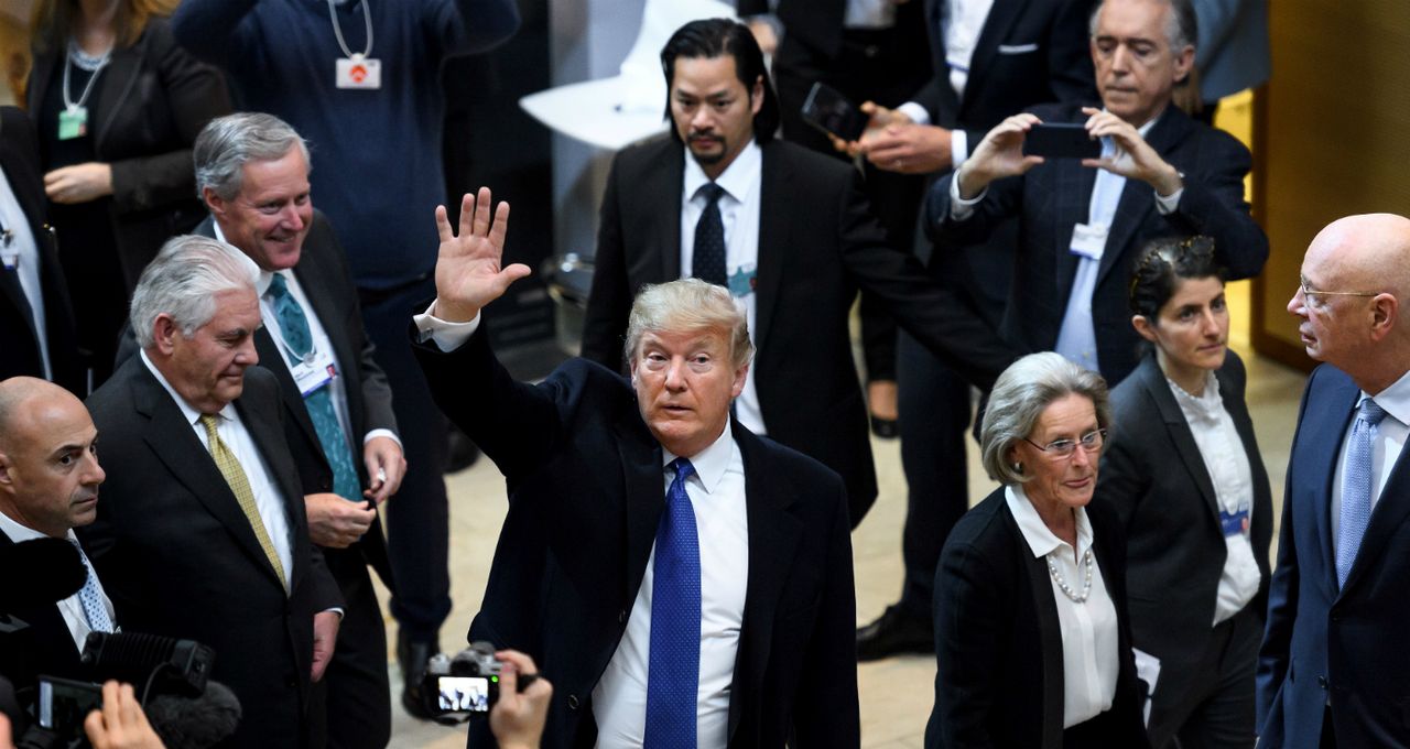 US President Donald Trump waves during the World Economic Forum meeting in Davos