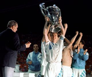 Didier Deschamps celebrates with the Champions League trophy after Marseille's win over AC Milan in the 1993 final.