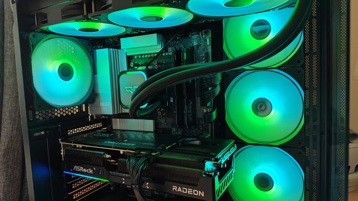 A photo of the innards inside a Quoted Tech Horizon Custom gaming PC with green and blue lighting