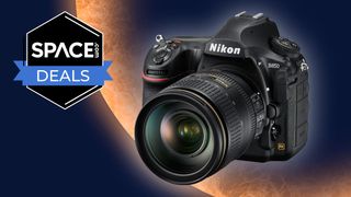 Nikon D850 in front of an eclipsed sun backdrop with space.com deal logo in the top left corner