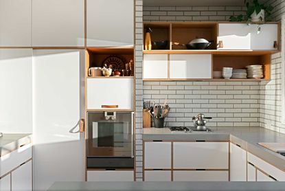 a small kitchen with open storage