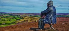 Seated figure on the North York Moors by Simon Penson