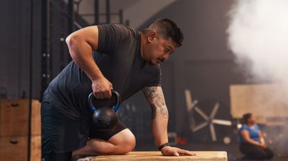 Man performing kettlebell rows