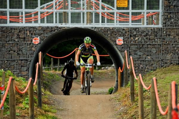 Ralph Naef (Multivan-Merida) heads out of the tunnel.